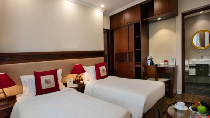Giường đôi tại phòng Au Coeur Comfort, Căn hộ Au Coeur d’Hanoi