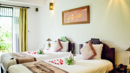 Phòng Coco Deluxe Garden tại Coco River Resort Hội An 4*