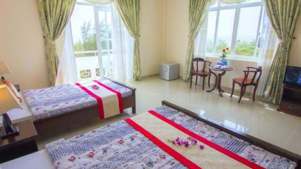 Phòng 1 giường đôi và 1 giường đơn tại Minh Đạm Vũng Tàu