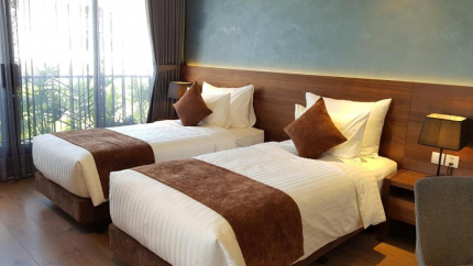Giường đôi tại Phòng Deluxe Double/Twin with Balcony khách sạn Orchid Boutique