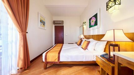 Hạng phòng Family Garden View Villa có thêm gam màu nâu cam ấm cúng