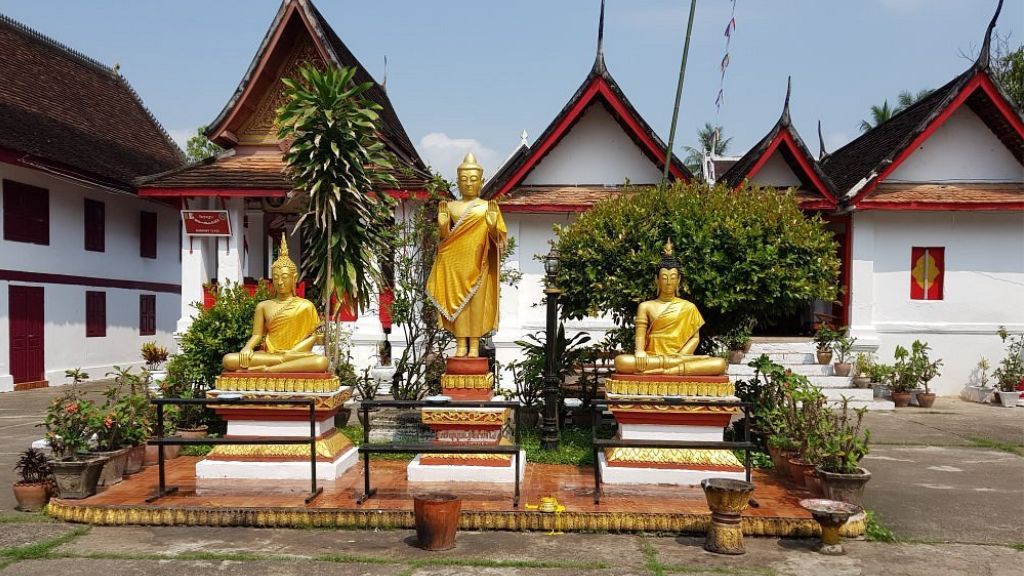 Tourists worship at Wat Mai temple